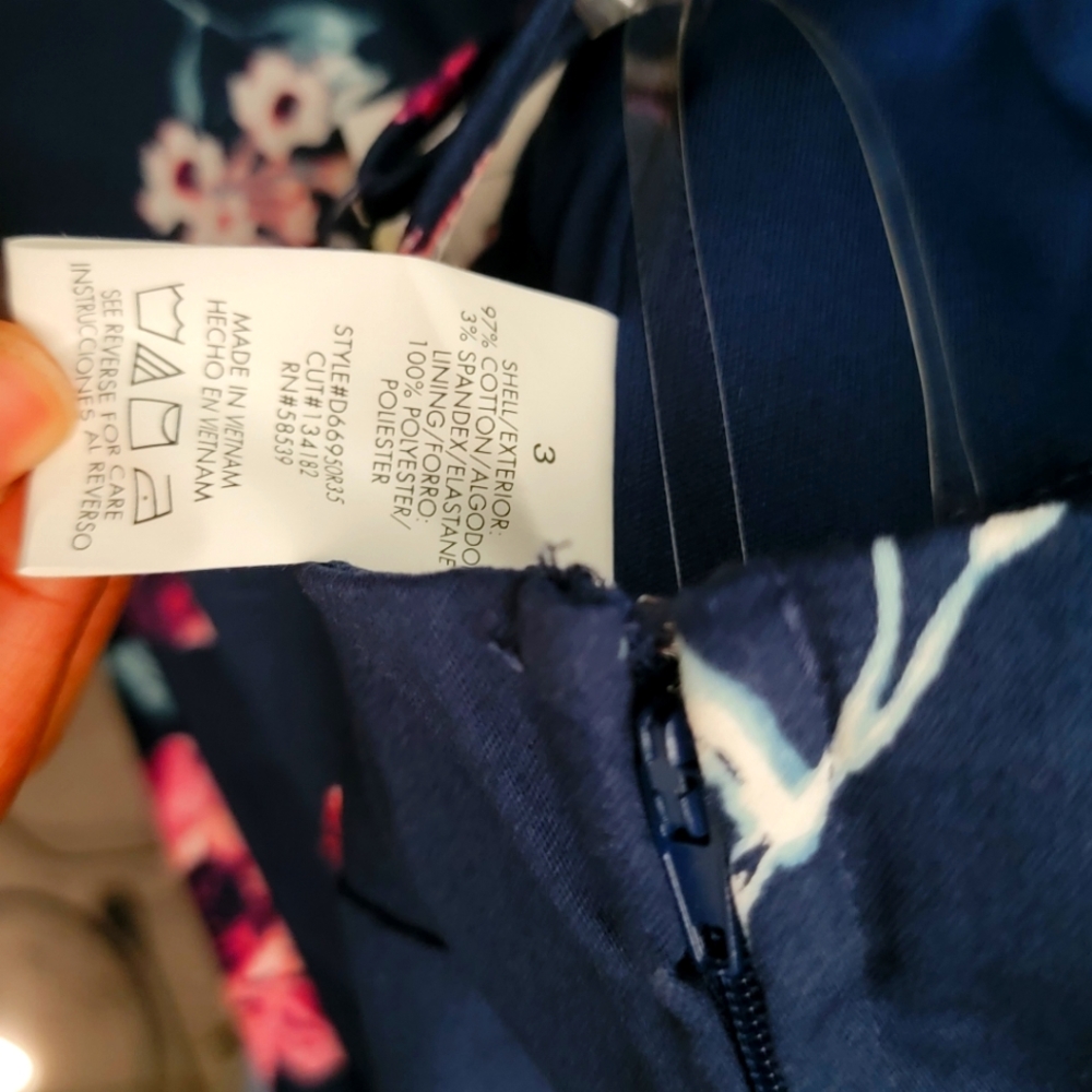 Macy's new dress never worn Navy Blue with flowers. Beautiful style design.